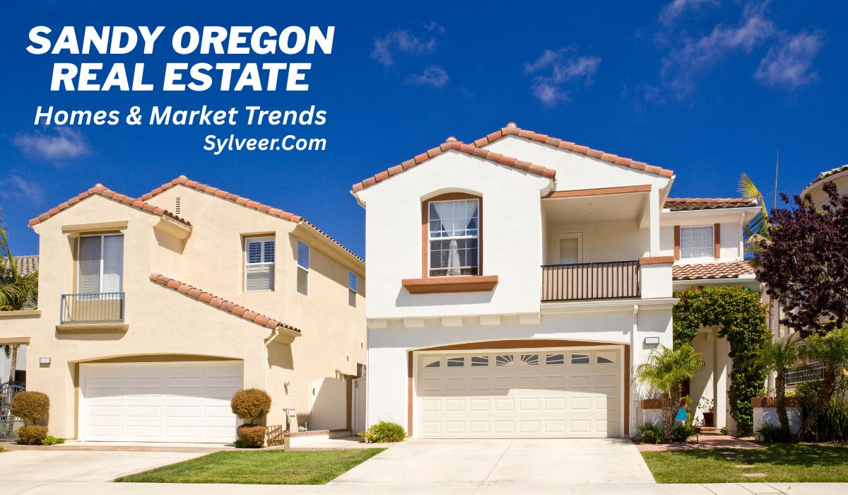 "Two modern suburban homes with Spanish-style architecture under a bright blue sky. Text overlay reads: 'Sandy Oregon Real Estate - Homes & Market Trends - Sylveer.Com'."