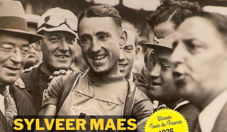 “Belgian cyclist Sylveer Maes smiling after winning the Tour de France in 1936, surrounded by supporters and fellow riders.”