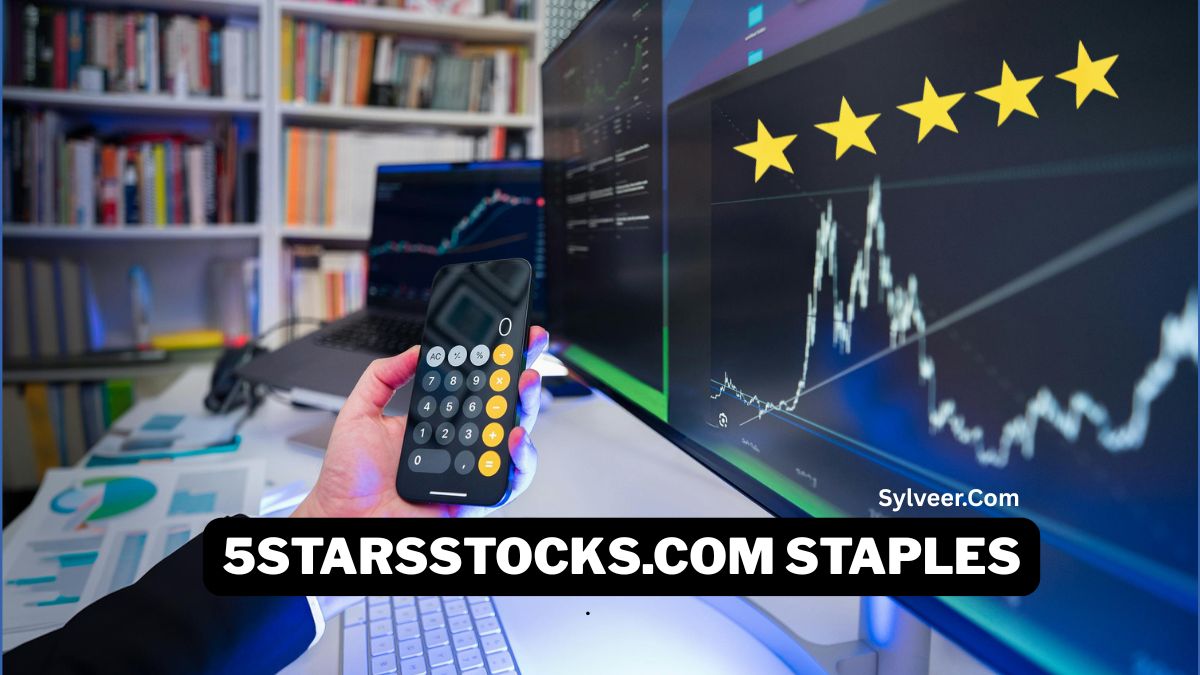 A person holding a smartphone calculator in front of computer screens displaying stock market charts and five-star ratings, with the text “5starsstocks.com Staples” on the image.